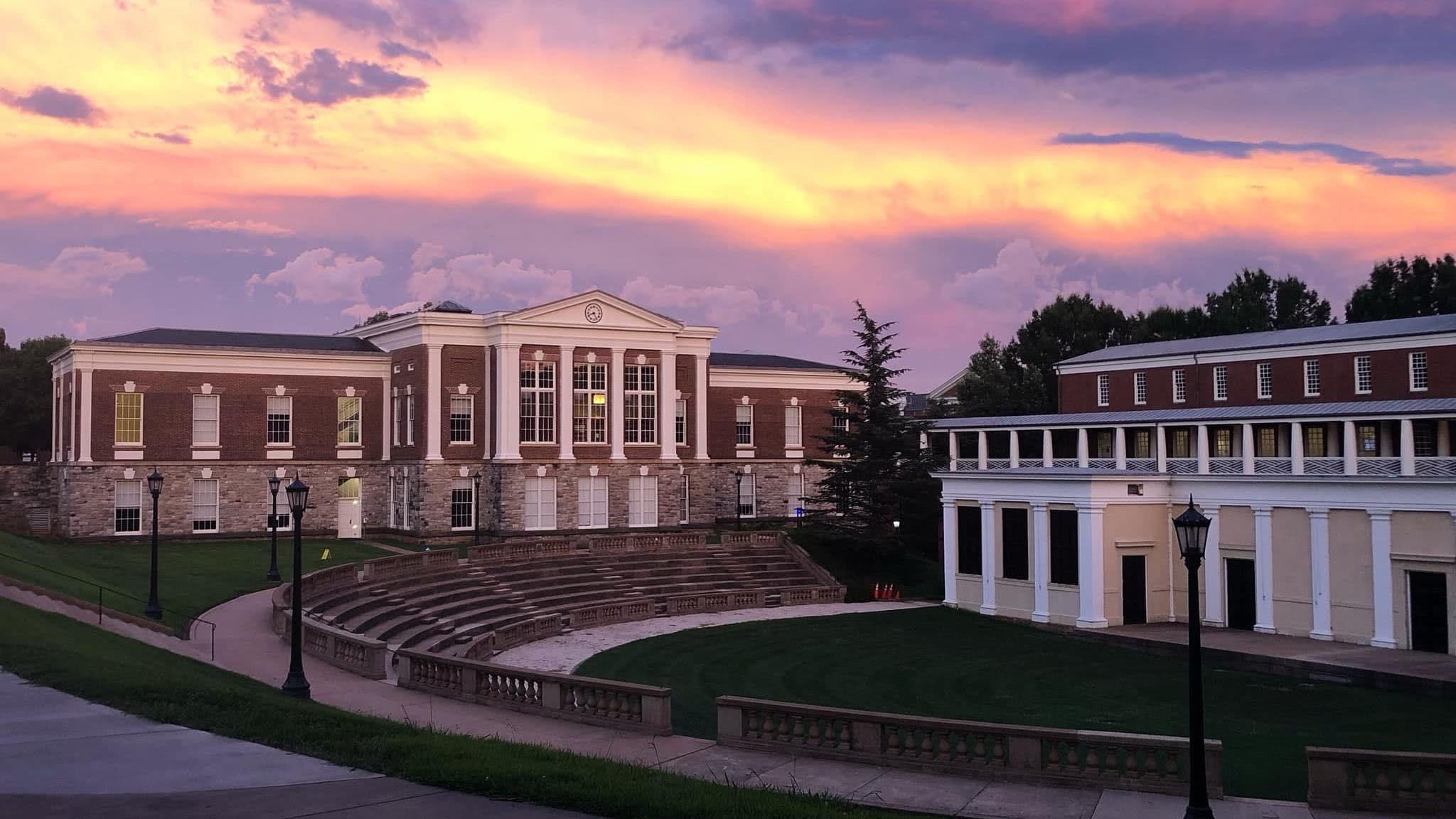 A stunning summer sunset over UVA campus buildings
