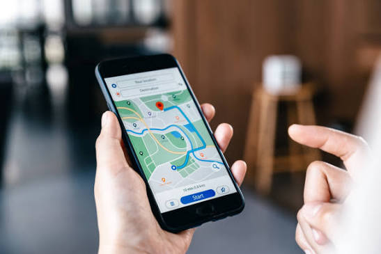 woman using Google Maps on her phone